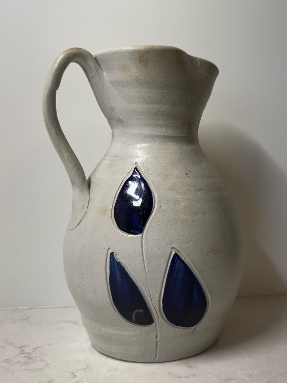Stoneware Ceramic Pitcher with Navy Leaf Motif